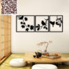 Set of 3 black metal panels featuring bird silhouettes on branches, displayed in a minimalist room with Japanese-inspired decor.