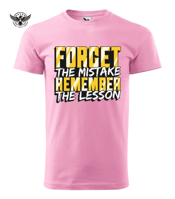 A pink T-shirt with a bold motivational print, reading "Forget the Mistake, Remember the Lesson" in black and yellow typography.