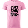 A pink T-shirt with the bold and cheerful print "Start the Day with a Smile".