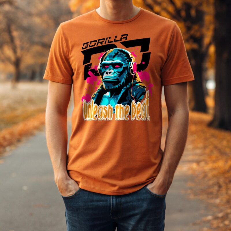 Man wearing orange T-shirt with gorilla DJ print and "Unleash the Beat" slogan in an autumn park.