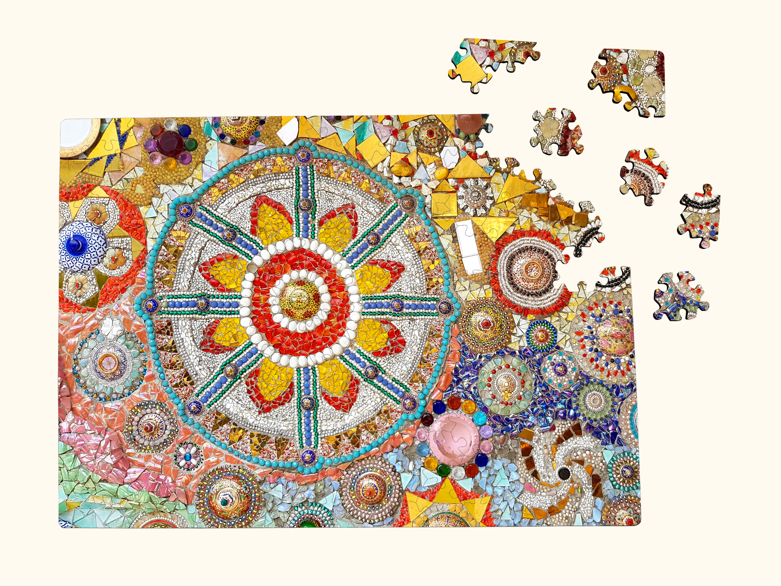 Partially assembled wooden jigsaw puzzle featuring a colorful mosaic mandala, with several loose laser-cut wooden pieces on a light background.