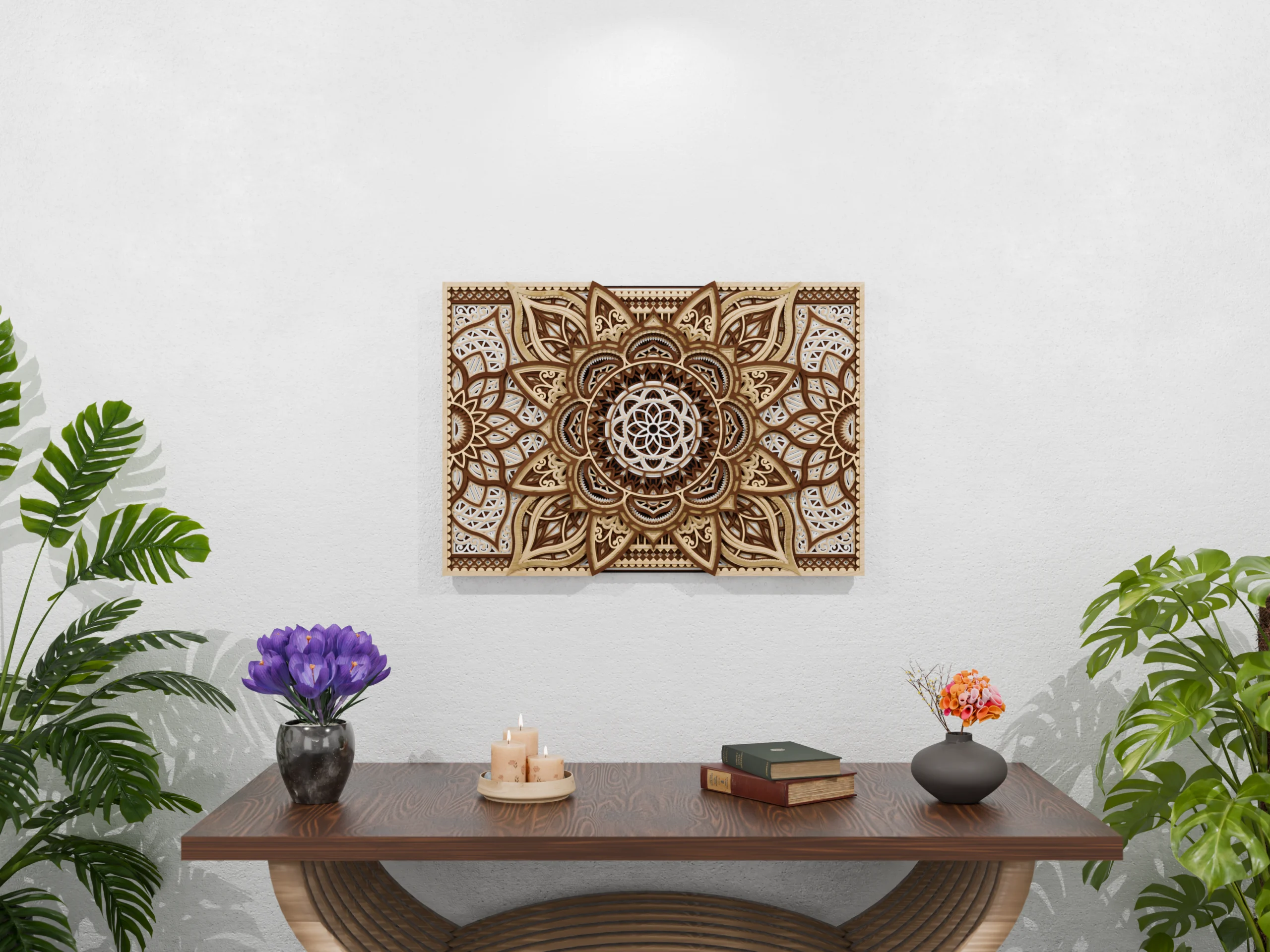 Multilayer wooden mandala wall art in natural wood tones displayed above a wooden console table, with candles, books, flowers, and green plants against a light textured wall.