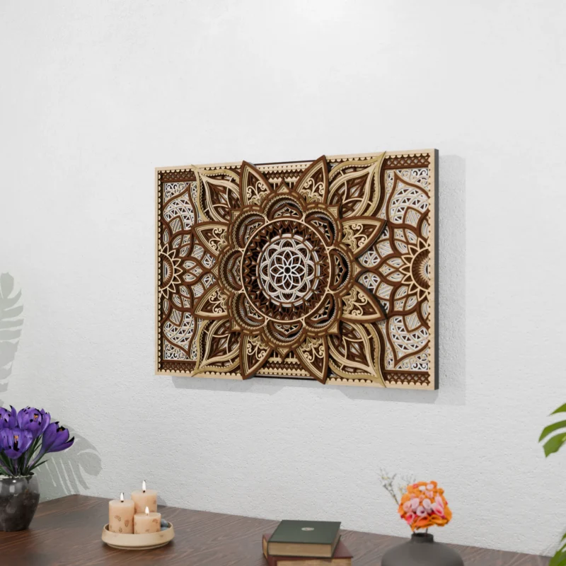 Multilayer wooden mandala wall art in natural wood tones mounted on a light textured wall above a wooden table with candles, books, flowers, and tropical plants.