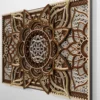 Close-up angled view of a multilayer wooden mandala wall art piece in natural wood tones, showing intricate carved details and layered depth against a light wall.