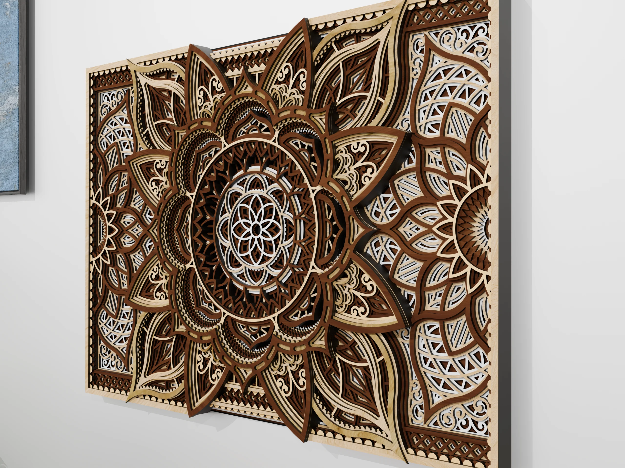 Close-up angled view of a multilayer wooden mandala wall art piece in natural wood tones, showing intricate carved details and layered depth against a light wall.