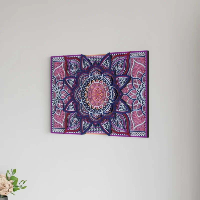 Rectangular multilayer wooden mandala wall art in pink, purple, navy, and white with a detailed floral geometric design displayed on a light wall