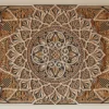 Front view of a multilayer wooden mandala wall decor in natural wood and black tones with detailed symmetrical carved layers