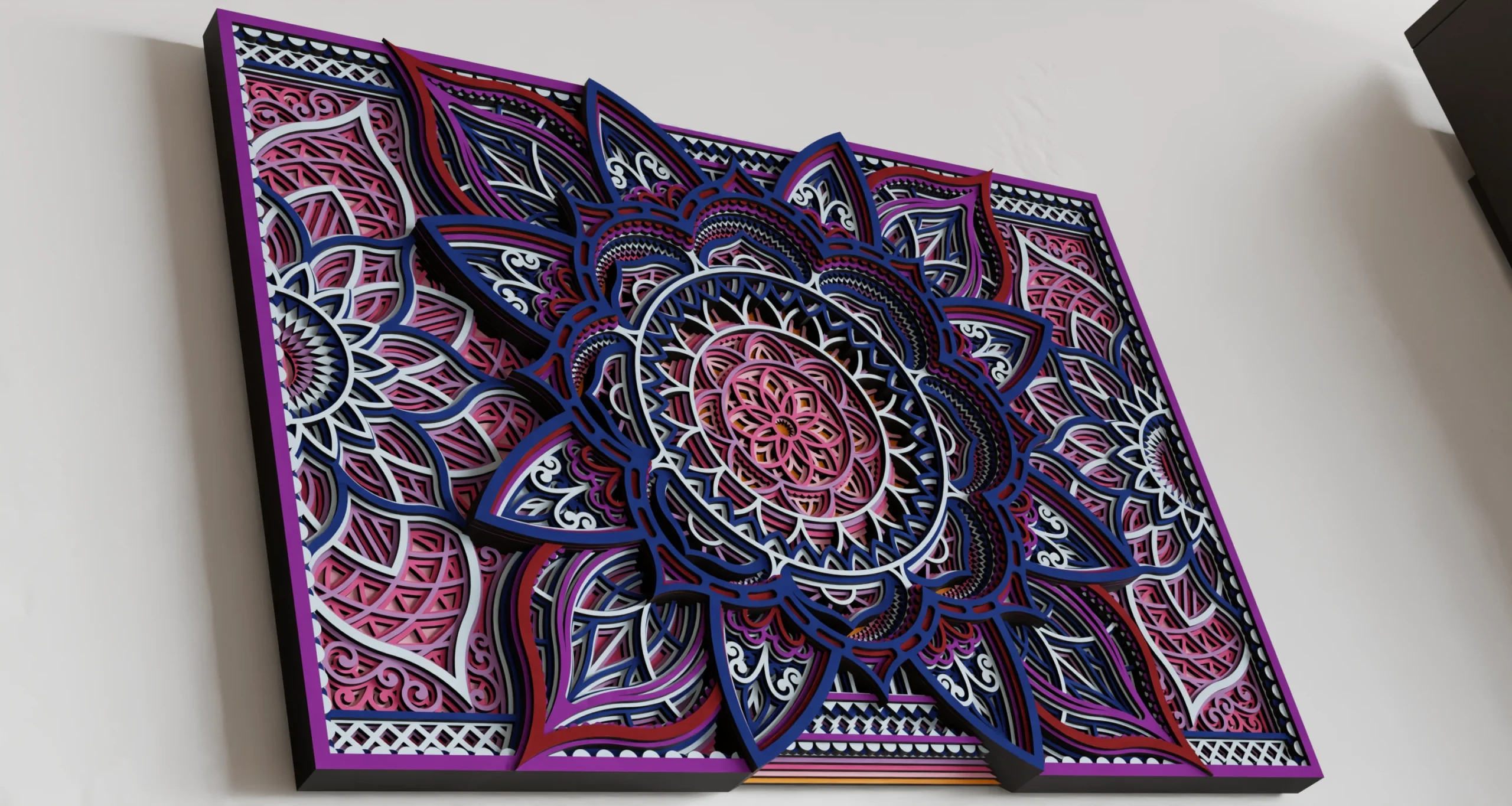 Close-up angled view of a rectangular multilayer wooden mandala wall art in pink, purple, navy, white, and black, featuring an intricate floral geometric design with pronounced layered depth
