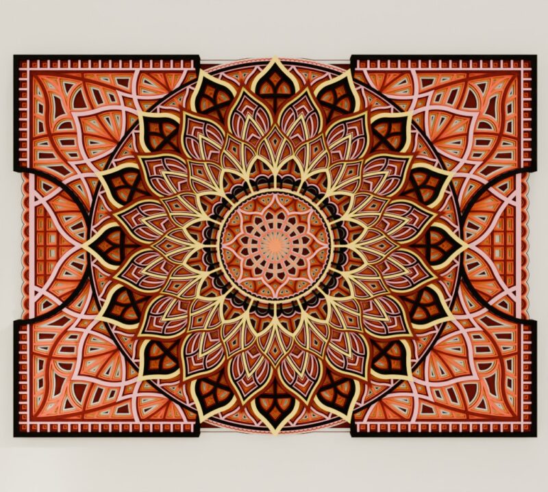 Close-up of a Multilayer Wooden Mandala in coral, black, and cream tones with a symmetrical layered design