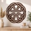Large Celtic knot wooden wall decor in a dark walnut finish displayed above a wooden console in a warm neutral interior.