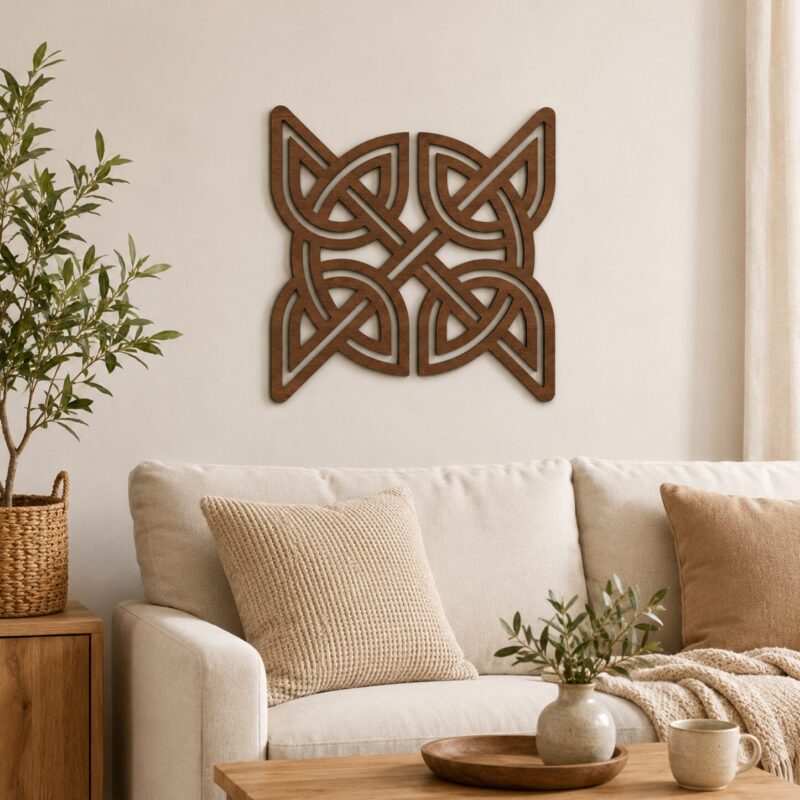 Dark wood Celtic knot wall decor displayed above a neutral sofa in a warm modern living room.