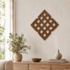 Wooden Celtic knot wall decor displayed above a bed in a warm neutral bedroom with natural wood furniture and soft textiles.