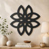 Black Celtic knot flower wall decor displayed above a console table