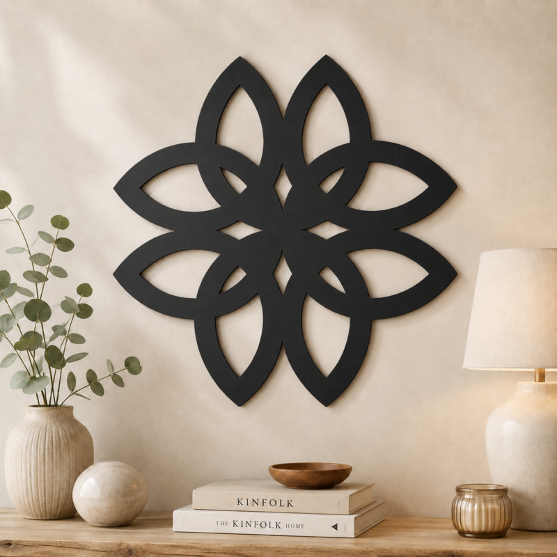 Black Celtic knot flower wall decor displayed above a console table